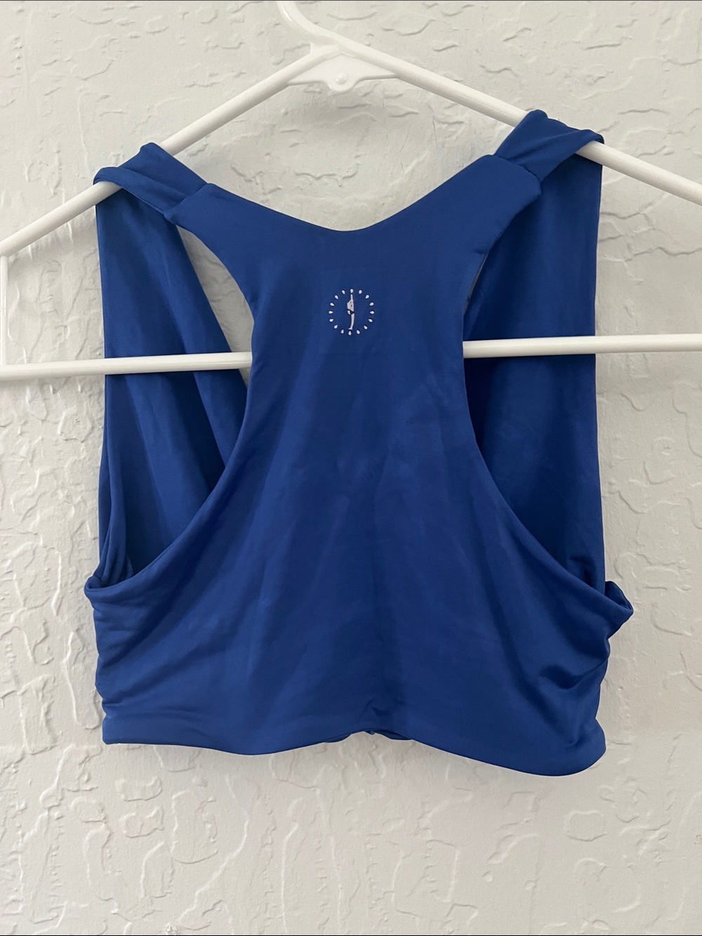 Blue Racerback Sports Bra with Center Back Logo by blue water dancewear.